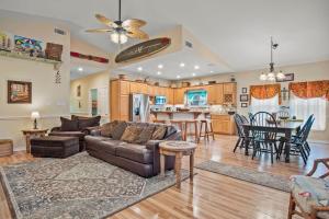 a living room with a couch and a table at Casa Playa - Ocean Views Pet Friendly Boardwalk in Port Aransas
