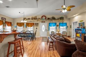 a living room with a couch and a table at Casa Playa - Ocean Views Pet Friendly Boardwalk in Port Aransas