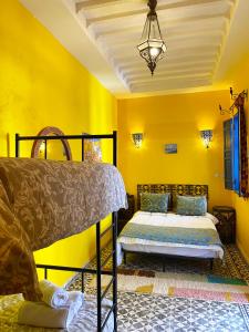 Postel nebo postele na pokoji v ubytování Riad Safi - maison historique