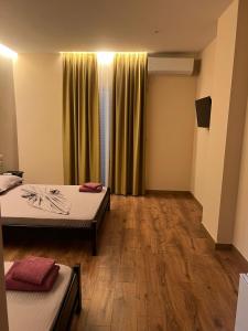 Postel nebo postele na pokoji v ubytování Hotel Nuanti