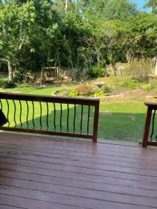 a bench sitting on top of a wooden deck at Room in a house in Lawrenceville in Lawrenceville