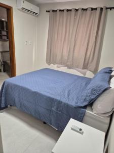 Ένα ή περισσότερα κρεβάτια σε δωμάτιο στο Conforto na Zona Sul