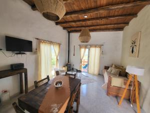 a living room with a couch and a table at El Vigía del Valle in Tafí del Valle