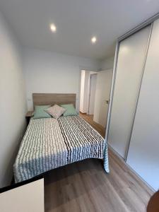 Katil atau katil-katil dalam bilik di Apartamento Miraldobra