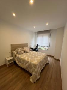 Katil atau katil-katil dalam bilik di Apartamento Miraldobra