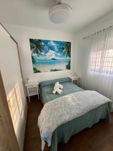 a bedroom with a bed with a teddy bear on it at Casa Moisés Atardecer in El Palmar +31 photos