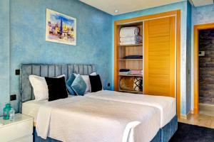 Postel nebo postele na pokoji v ubytování Appartement de luxe sur agadir bay + 19 fotografií