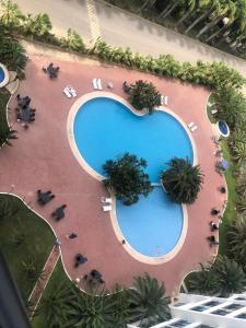 an overhead view of a swimming pool at a resort at Punta Centinela in Punta Blanca