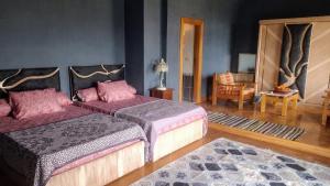Postel nebo postele na pokoji v ubytování Alf Layla Resort