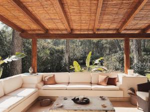 a living room with a white couch and a table at Villa in Apulia with pool near Ionian Sea in Castellaneta