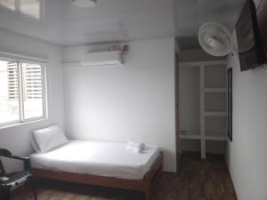 Postel nebo postele na pokoji v ubytování Hotel Melemar