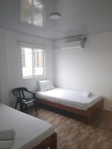 Postel nebo postele na pokoji v ubytování Hotel Melemar