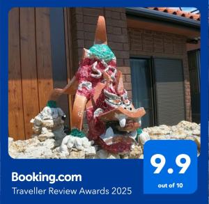 a statue of a woman with a carrot on her head at CARA-YA(かーらやー） in Ishigaki Island