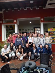 a group of people posing for a picture in a room at Casona Don Juan Hostel in San Gil +271 photos