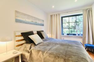 Ένα ή περισσότερα κρεβάτια σε δωμάτιο στο Ferienhaus Backbert & Steuerbert Kappeln Kopperby