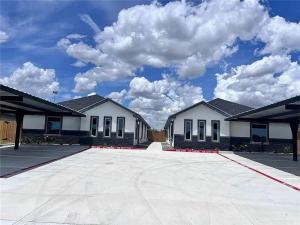 a group of buildings with a sky with clouds at Serene Mission Oasis! in Mission