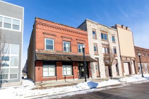 an old brick building on the corner of a street at NEW! Remodeled & Upgraded Vacation Apartment in Sandusky