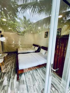 Postel nebo postele na pokoji v ubytování Hoang Phuc resort