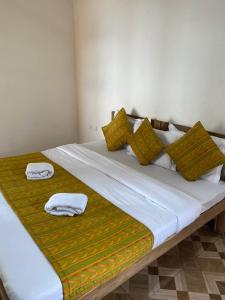 Postel nebo postele na pokoji v ubytování Baga Beach Prime