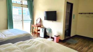 Voodi või voodid majutusasutuse 池上投優榻 Smart living B&B toas