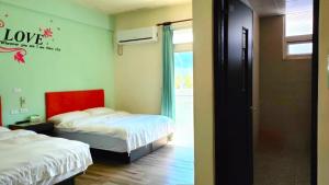 Voodi või voodid majutusasutuse 池上投優榻 Smart living B&B toas