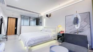 Voodi või voodid majutusasutuse 西双版纳回见江景酒店 toas