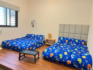 Postel nebo postele na pokoji v ubytování Dou Dou Long Homestay