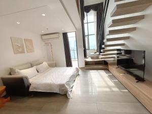Posteľ alebo postele v izbe v ubytovaní Zhongshan Perth Hotel Apartment - Shiqi Wanxianghui Branch