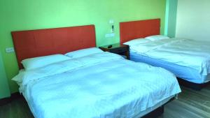 Voodi või voodid majutusasutuse 池上投優榻 Smart living B&B toas