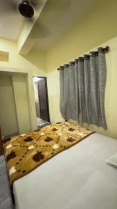 Letto o letti in una camera di Mysuru-hotel
