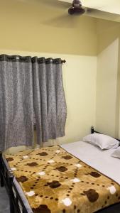 Letto o letti in una camera di Mysuru-hotel