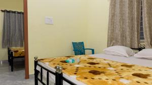 Letto o letti in una camera di Mysuru-hotel