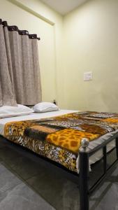 Letto o letti in una camera di Mysuru-hotel
