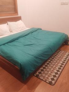 Postel nebo postele na pokoji v ubytování Equatorial Inn