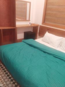 Postel nebo postele na pokoji v ubytování Equatorial Inn