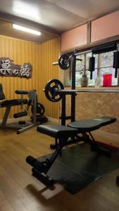 a gym with several tread machines in a room at Akiu Canada 鴻の巣温泉 Konosu Onsen in Sendai