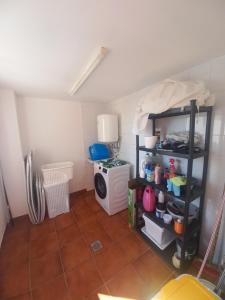 a kitchen with a stove and a microwave at VILLA CHRIS Ocean View in La Jaca