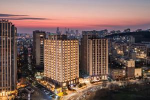 a view of a city at night at Madison Hotel, Qingdao Laoshan Polar Ocean Park in Qingdao