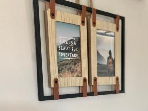 a picture frame hanging on a wall in a room at fattoria Coppetella Cemani in Molino dʼAgugliano +15 photos