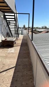 a walkway leading to a empty baseball stadium at Escape de altura in San Luis Río Colorado