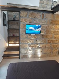 TV a/nebo společenská místnost v ubytování Le Gemelle Diverse