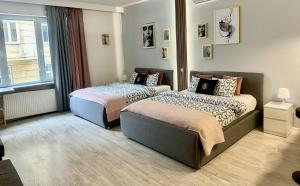 Posteľ alebo postele v izbe v ubytovaní Exclusive Apartments Smolna