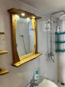 a bathroom with a mirror and a sink at Casa Spartines in Votsi +40 photos