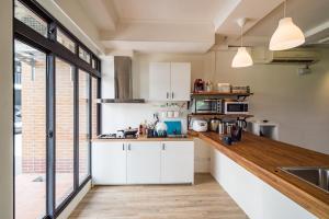 Kuchyň nebo kuchyňský kout v ubytování Dongshan Yi Hostel