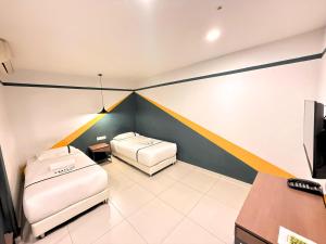Postel nebo postele na pokoji v ubytování Smile Hotel Seri Kembangan + 33 fotografií
