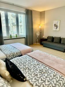 Posteľ alebo postele v izbe v ubytovaní Exclusive Apartments Smolna