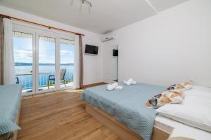 Posteľ alebo postele v izbe v ubytovaní Apartments MAJA