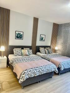 Posteľ alebo postele v izbe v ubytovaní Exclusive Apartments Smolna