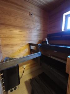 a room with two bunk beds and a television at Royal Katariina in Kokkola