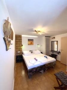 a bedroom with a large bed in a room at Village Villa Marika Drapanias in Drapaniás
